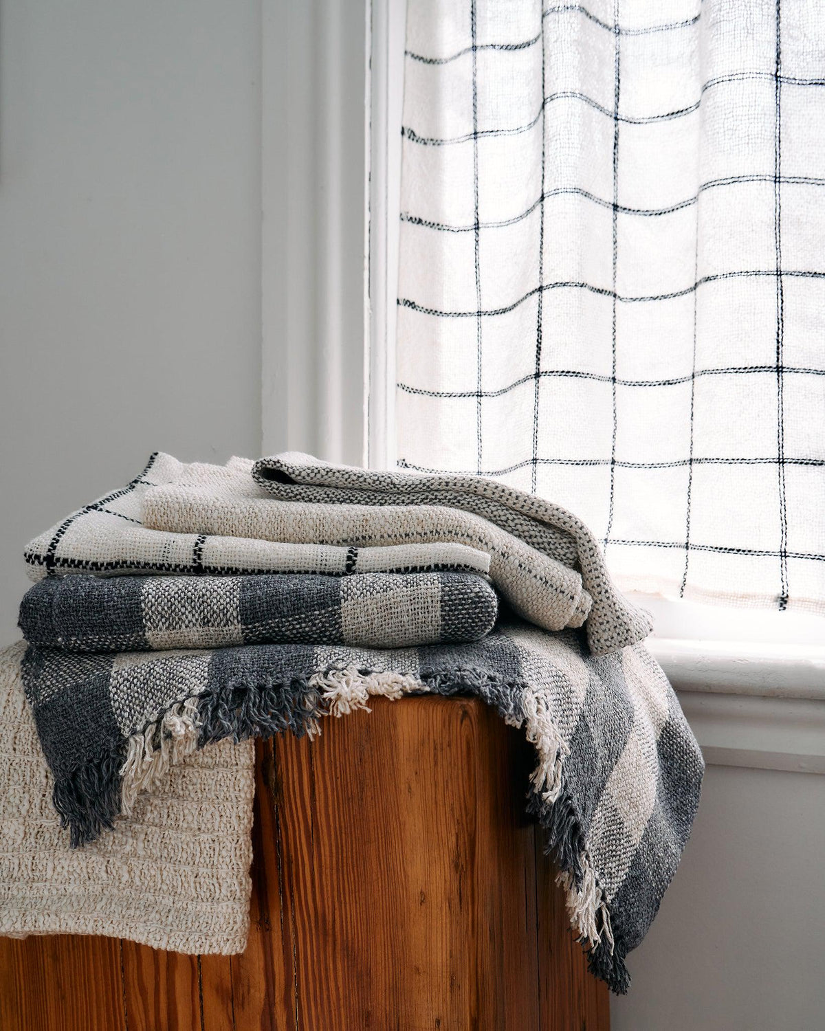 Forest Walk - Set of Three Patterns featuring folded handwoven textiles with minimalist grid and stripe designs.