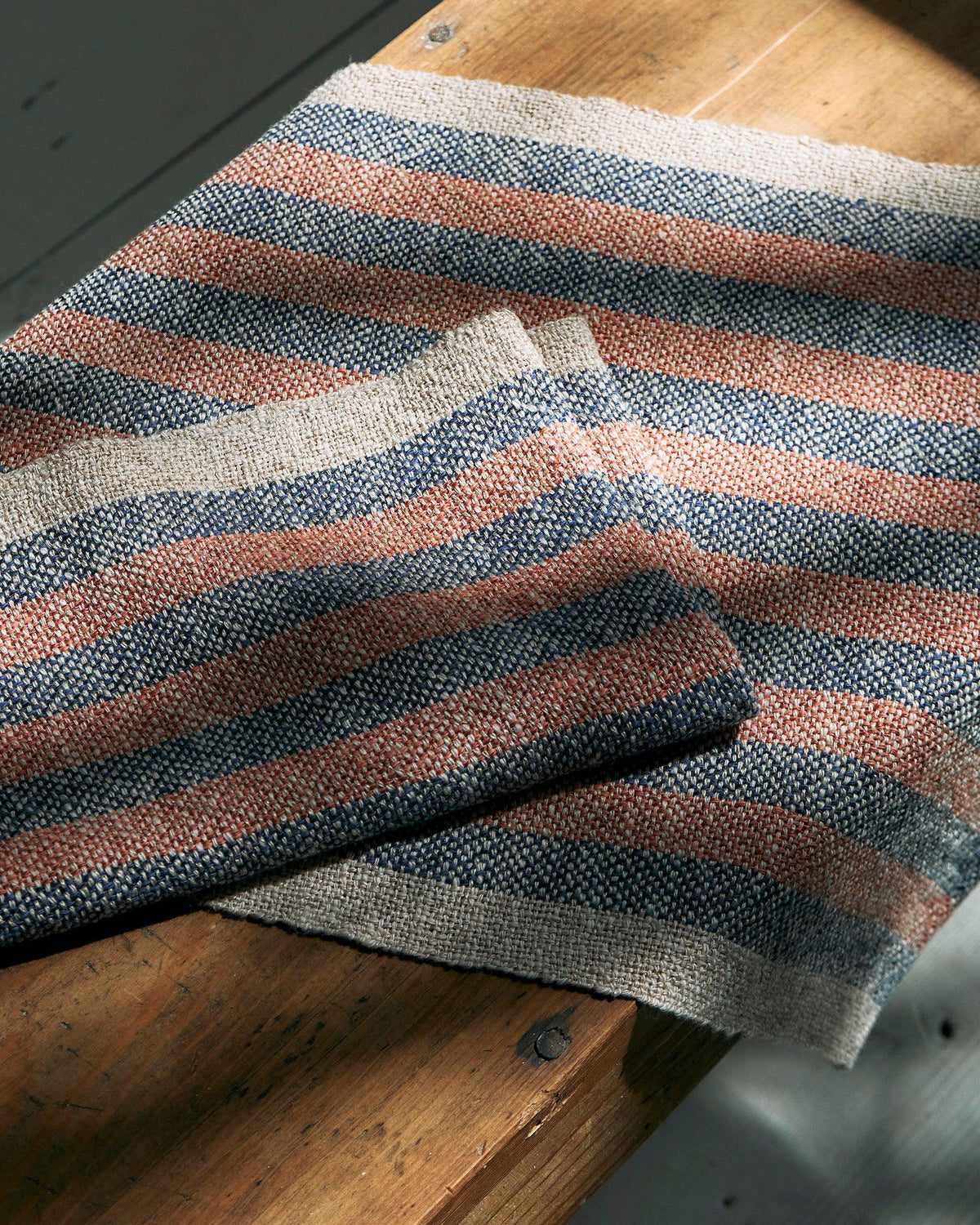 Duet Favorites - Set of Two Patterns showing striped woven towels in rust, blue, and natural linen colors.